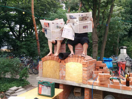 Two BBQ builders on the chimneys
